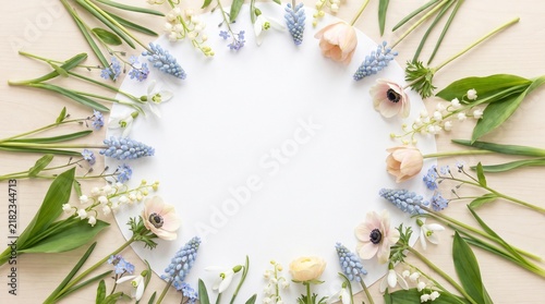 Delicate spring floral arrangement framing a blank white space, perfect for text or design elements