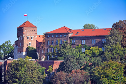 Wawel Royal Castle Complex with Thieves Tower and Polish Flag in Krakow Poland
