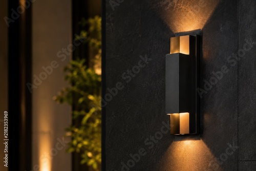Modern Up and Down Wall Sconce Lighting on Dark Exterior Wall