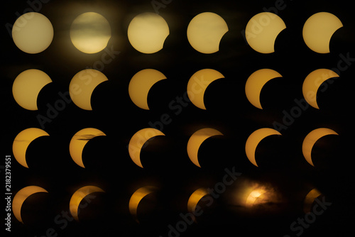 Eclipse of Sun, August 12, 2026. The sun is a gold dish in the sky gradually covered by the moon.