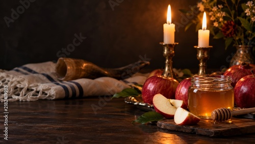 Rosh Hashanah still life with shofar apples honey and candles
