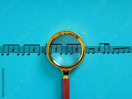 Obraz na płótnie Magnifying glass analyzing musical score notes on blue