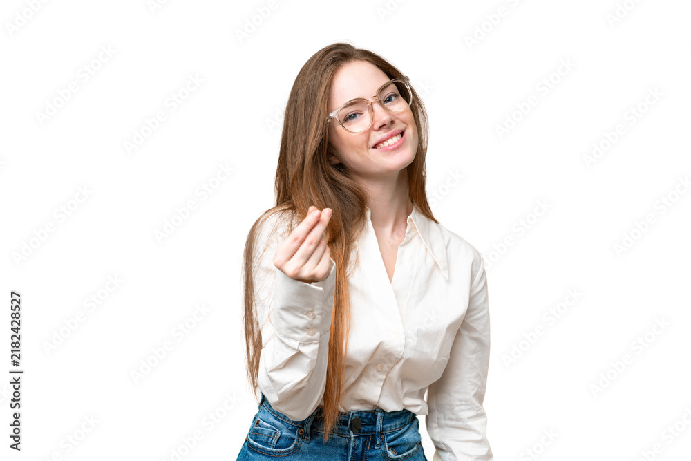 Obraz premium Young pretty woman over isolated chroma key background making money gesture
