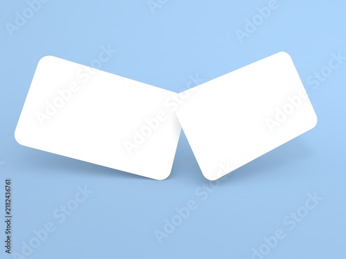 Two blank cards displayed at an angle on a light blue background