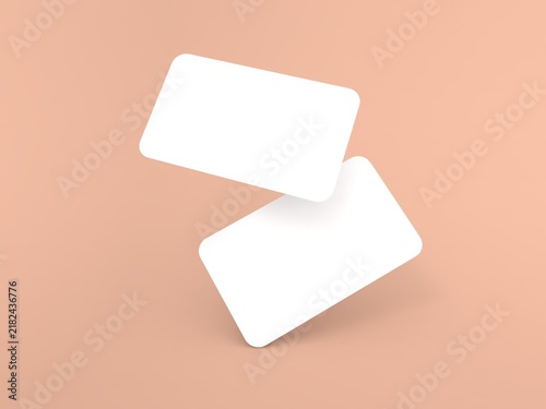 Two blank cards placed at an angle on a soft peach background