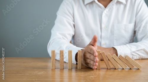 Risk prevention, crisis control, domino effect and business stability concept.