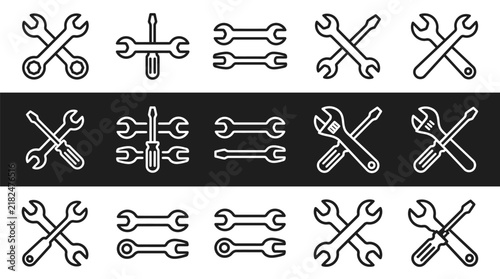 Various black and white icons of wrenches and screwdrivers for repair and maintenance purposes shown