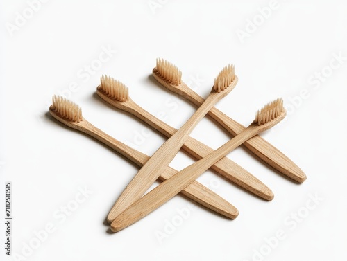 Eco-friendly Bamboo Toothbrushes on White Surface