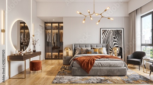 Luxurious master bedroom featuring a large upholstered bed frame with plush textiles and a vanity table setup alongside a spacious walk in wardrobe for stylish dwelling and comfortable house
