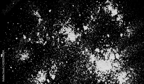 Bild auf Leinwand White flour or powder splash isolated on black background, texture of dry dust p