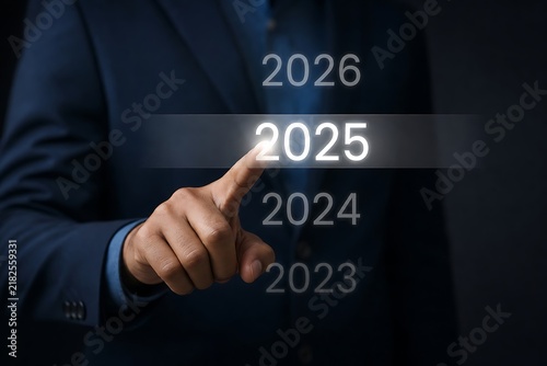 Business executive selecting the year 2025 on a virtual digital interface for future planning