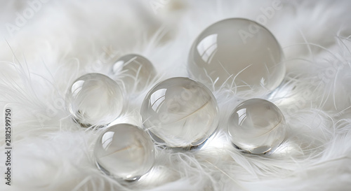 Clear glass water droplets on white surface