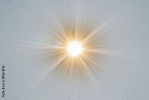 The Sun Burst Over a Pale Sky with Radiant Radial Light Rays