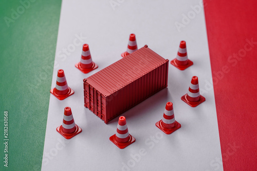 Obraz na plátně The cargo container ban on the Italian flag as a conceptual backdrop