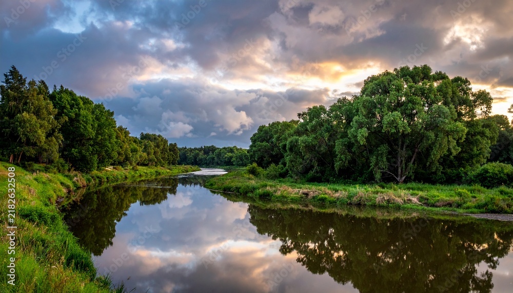 Obraz premium Quiet River Mirroring Dramatic Clouds at Sunset Landscape