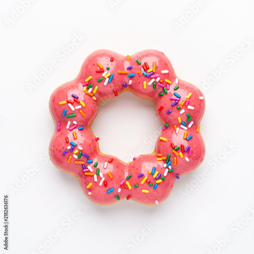 Delicious pink donut with sprinkles brings pure joy and happiness
