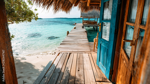 Tropical paradise beckons: Open door to turquoise waters and pier