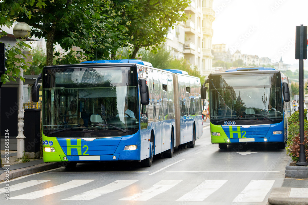 Obraz premium A modern hydrogen bus driving on a city street