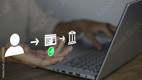 Payment and secure online banking transaction concept. Person using laptop to verify identity with user icon, ID card checkmark, arrow, and bank building icon for safe financial service