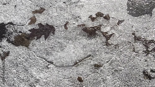 close view of ice on pavement in winter