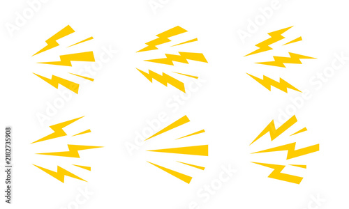 Cuadro en lienzo Yellow electric lightning bolt icon set featuring multiple sparks and flash shapes for energy power speed warning hazard themes isolated on white background design
