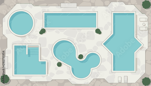 Overhead view shows several swimming pools of various geometric shapes and sizes in a luxury resort or hotel leisure complex garden.