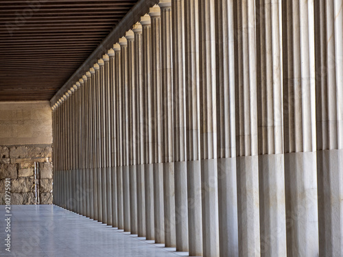 Canvas Print Row of ancient Greek columns forming a covered colonnade