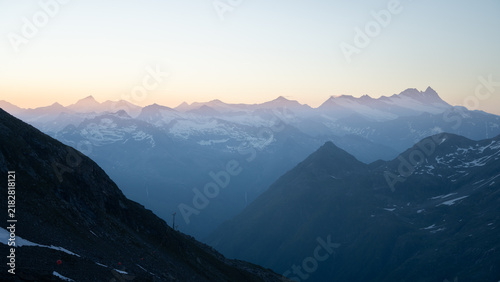 Photography Panoramic alpine sunrise view from Grossvenediger with layered mountain ridges a