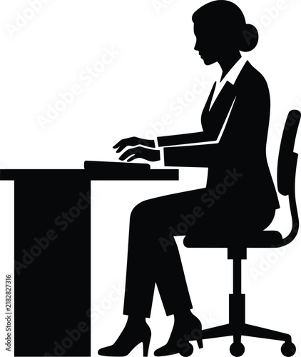 Foto Silhouette of a professional businesswoman sitting at an office desk typing on a
