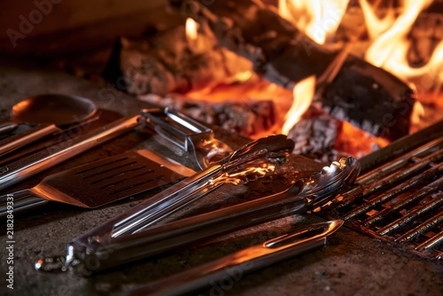 Obraz na płótnie Barbecue grill tools with fire and coals