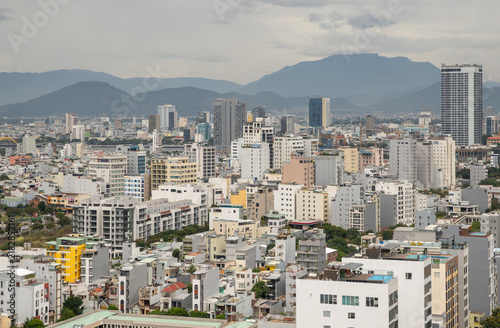 Konstfotografi Dense Da Nang cityscape with mountain backdrop, Vietnam