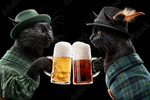 Black cats in Bavarian hats clinking beer mugs isolated on black background, Oktoberfest concept