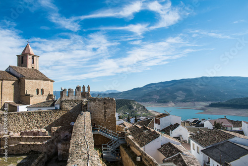 Historic Iznájar village overlooking the reservoir and olive groves in Andalusia, Spain