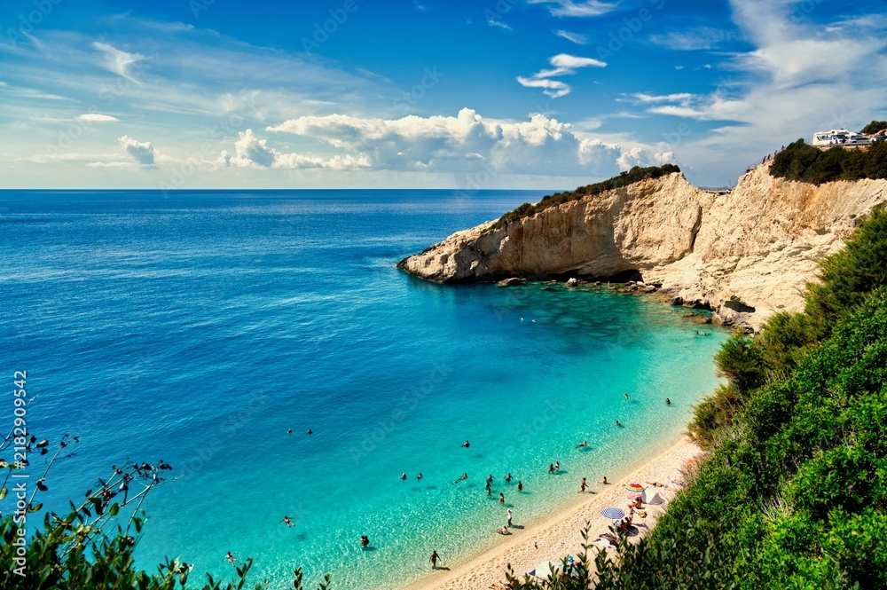 Obraz premium Swimmers in crystal clear turquoise water at Porto Katsiki beach in Lefkada island Greece