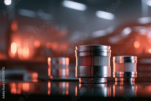 Professional camera lenses arranged on reflective surface with warm ambient lighting in photography studio setting