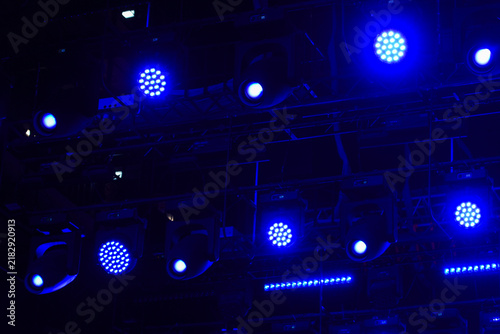 Grid of blue stage lights.