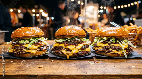 Three Juicy Beef Smash Burgers with Melted Cheese and Lettuce on a Rustic Table at a Night Food Market