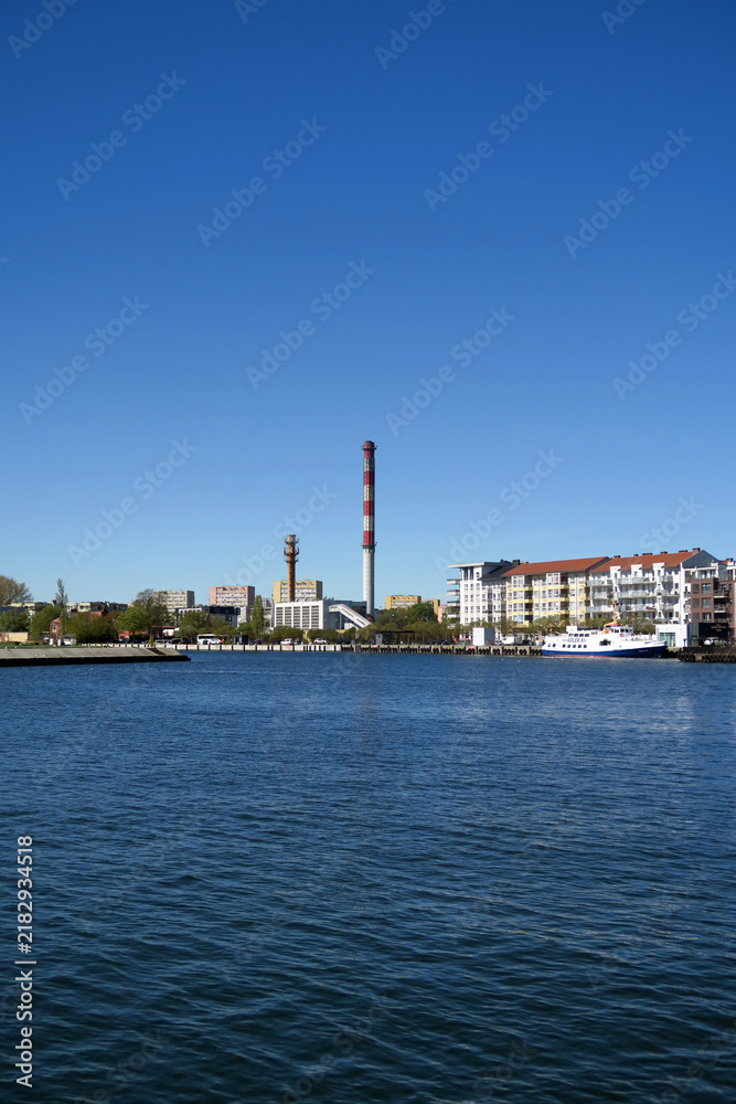 Fototapeta premium Świnoujście, Poland. The Świna River is a river in Poland that flows from the Oder Lagoon into the Baltic Sea, between the islands of Usedom and Wolin.