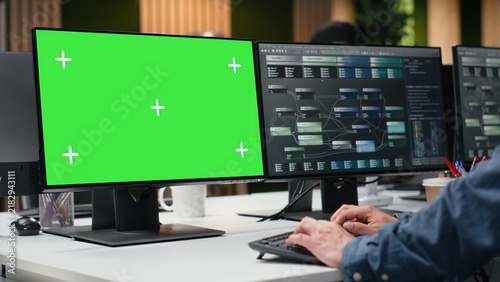 Fotografie Admin analyzes machine learning algorithms on a green screen office PC, reviewing code on a chroma key computer to improve artificial intelligence