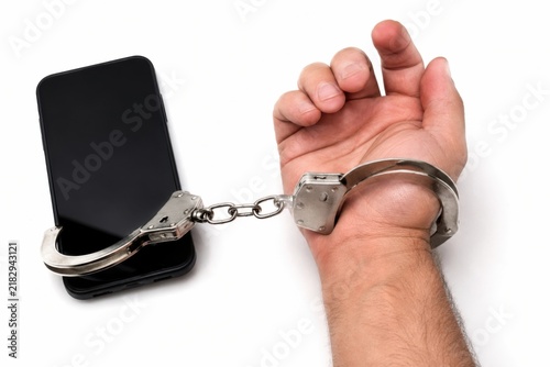 Obraz na płótnie Handcuffed to Phone
