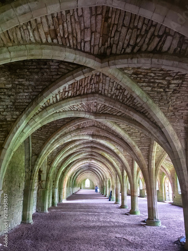 Fotografie Fountains Abbey is a ruined Cistercian monastery near Ripon in North Yorkshire, England