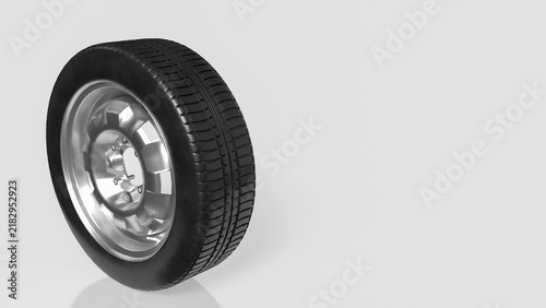 Fotografie Black Rubber Tire with Shiny Silver Rim on Light Background 3d render