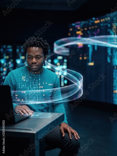 Specialist working a suspended holographic panel at a data wall