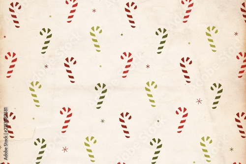 Seamless holiday pattern with red and green candy canes on paper background