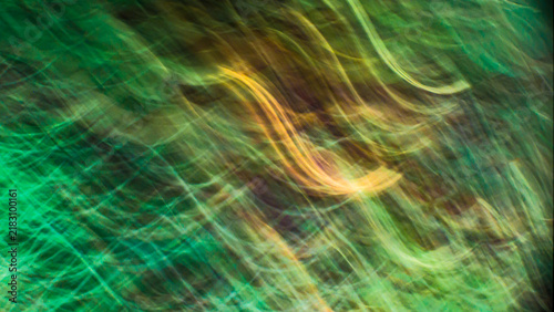 Obraz na plátně Abstract intentional camera movement icm of green foliage with golden light