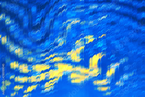 Abstract Blue and Yellow Swirling Waves Background