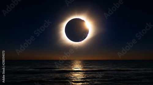Breathtaking total solar eclipse illuminating calm ocean waters at sunset showcasing the beauty of this celestial event in a peaceful seascape