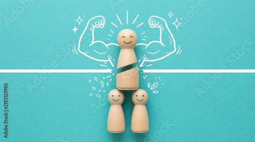 Wooden figure breaking through barrier with muscle illustration