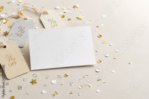 Horizontal card mockup styled with percentage off tags and confetti