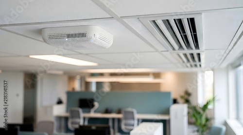 Modern Office Ceiling with Air Purifier and Ventilation System in Bright Workspace